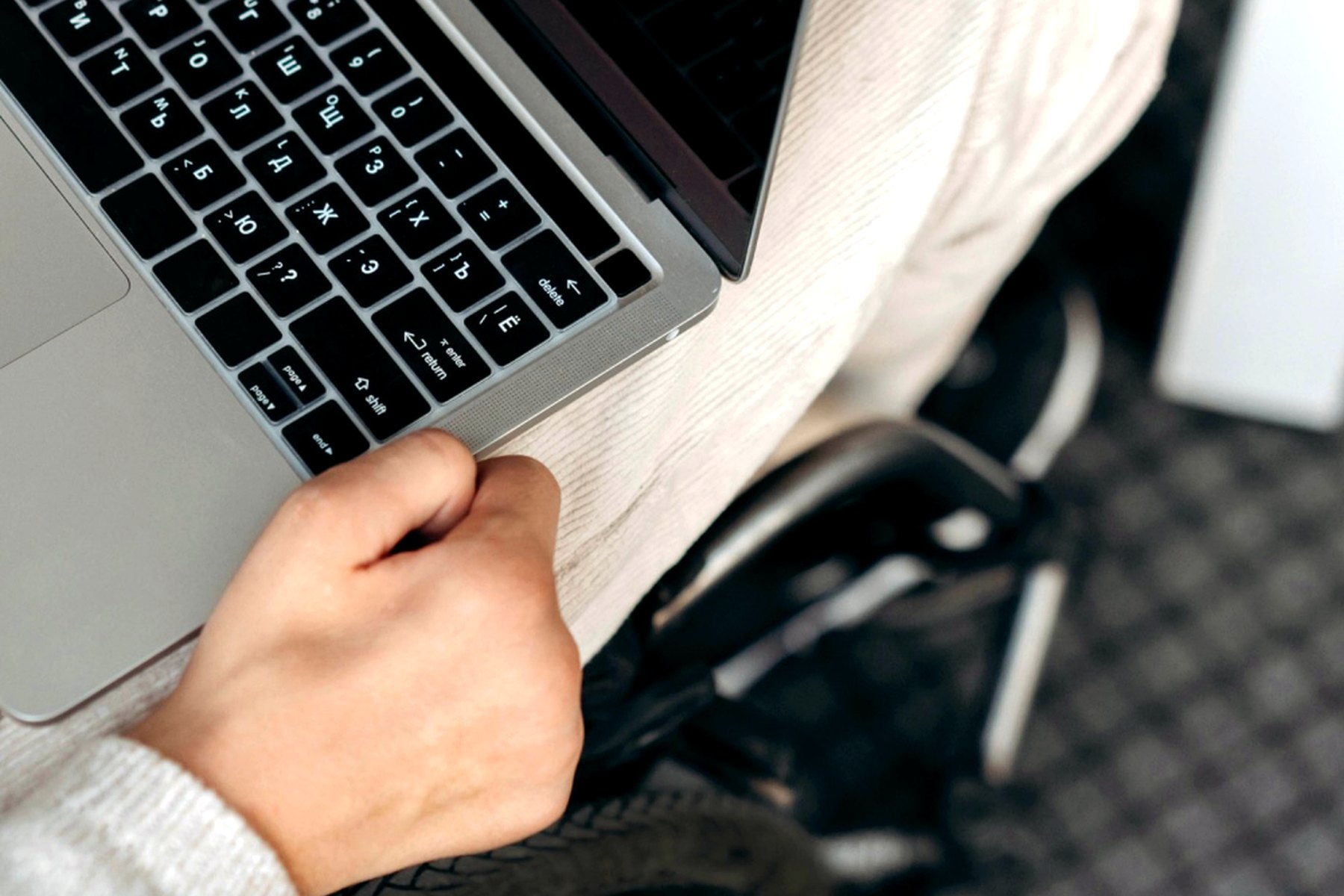 A person using accessible technology comfortably at home